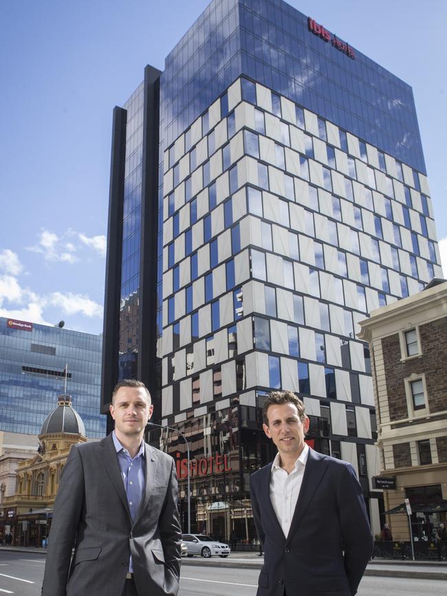 Ibis Adelaide general manager Nathan Frost and Hines Group's James Hines at the front of the new Ibis Hotel in Grenfell Street ... the venue opened last month.