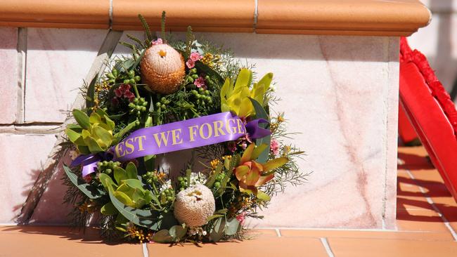 A wreath at the Anzac Park cenotaph at the 54th anniversary commemoration of the Battle of Long Tan. Picture Rodney Stevens