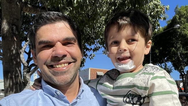 Mark Kenafack with son Marley outside Emerald courthouse after the jury reached a not guilty verdict with regards to a charge of grievous bodily harm where Mr Kenafack had been accused of assaulting his former partner's uncle, Daniel Garner.