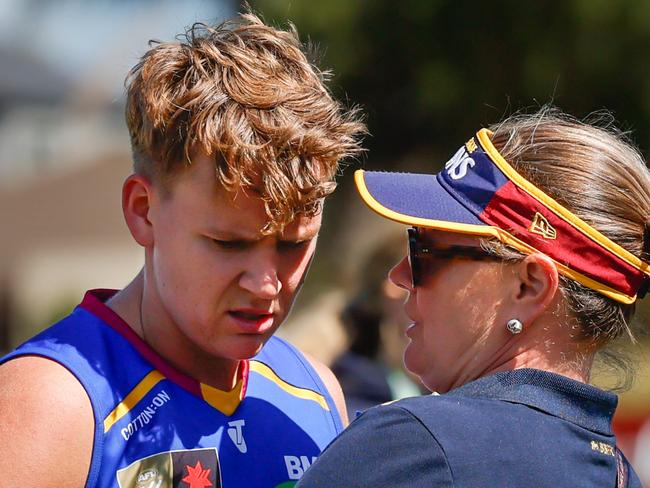 MELBOURNE, AUSTRALIA - NOVEMBER 03: Dakota Davidson of the Lions is consoled by a staff member during the 2024 AFLW Round 10 match between Euro-Yroke (St Kilda Saints) and the Brisbane Lions at RSEA Park on November 03, 2024 in Melbourne, Australia. (Photo by Dylan Burns/AFL Photos via Getty Images)