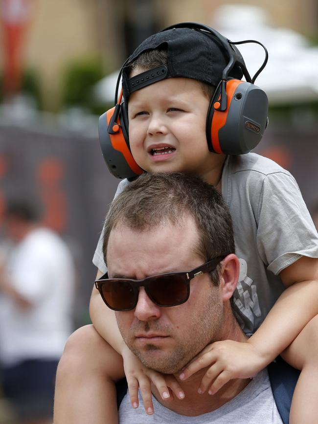 A young Supercars fan takes a ride around the track. Picture: Darren Pateman