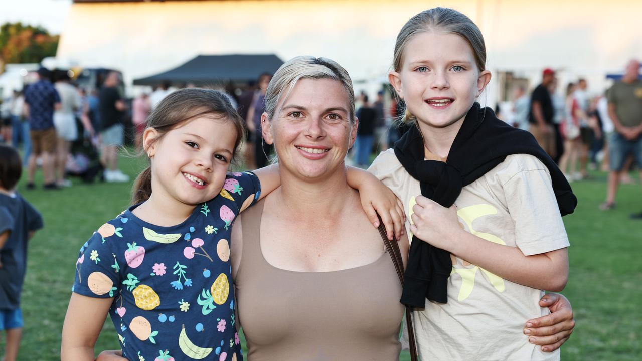 Aria Pezzutti, 5, Sophie Pezzutti and Briella Pezzutti, 10, at the Barron River Food Festival, held at the Stratford Dolphins Football Club. Picture: Brendan Radke