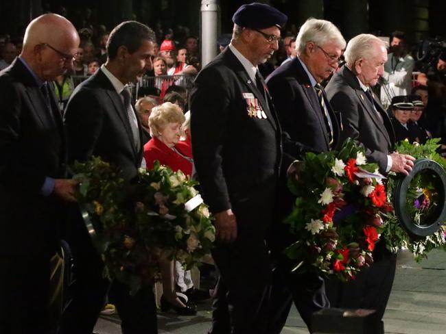 John Haines (second from right) prepares to lay a wreath at the Cenotaph in Martin Place this morning. Picture: Bill Hearne