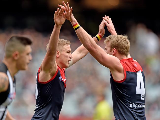 Bernie Vince and Jack Watts celebrate an early goal for the Dees.