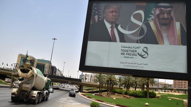 A giant billboard bearing portraits of US President Donald Trump and Saudi Arabia's King Salman, is seen on a main road in Riyadh, on May 19, 2017. Trump, on his first foreign trip since taking office in January, told Muslim leaders of his “hopes for a peaceful vision of Islam” as he sought support for the war against radical Islamists. AFP / Giuseppe Cacace.