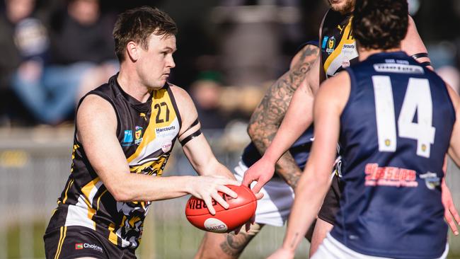 Tigers Luke Graham prepares to send the ball forward. Picture: Linda Higginson