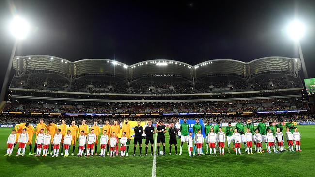 The Socceroos and Saudi Arabia teams line up for the World Cup qualifier at Adelaide Oval in 2017. Picture: Daniel Kalisz/Getty Images