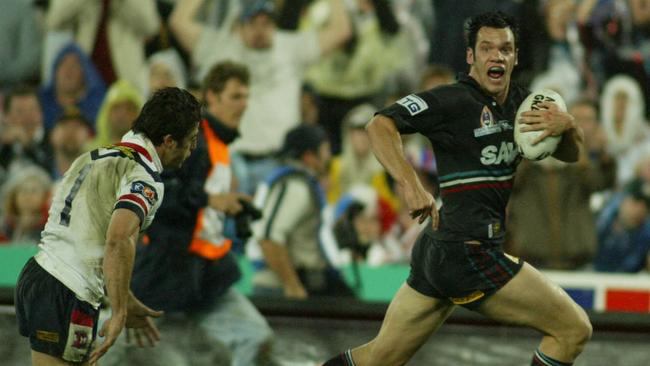 Luke Rooney grabs a try as the Panthers win the 2003 decider.