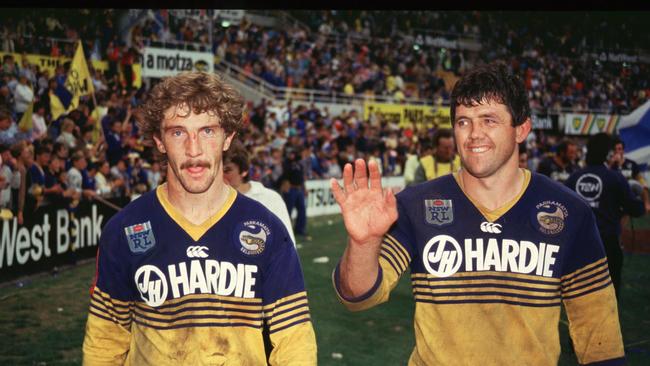 (L-R) Brett Kenny and John Muggleton enjoy a lap of honour after the 1986 grand final. Picture: Action Photographics