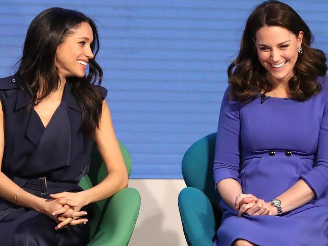 Meghan sharing a laugh with Kate at the first working appearance of the ‘fab four’ young royals in London. Picture: Chris Jackson/Getty Images