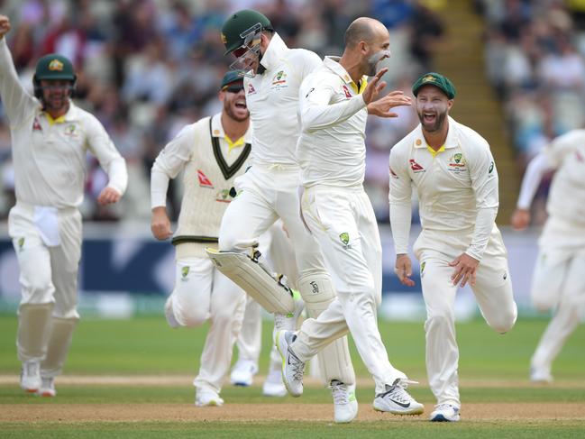 Australia captain Tim Paine celebrates with Nathan Lyon after the pair had combined to dismiss Ben Stokes. Picture: Stu Forster/Getty Images