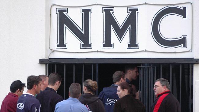 Police officers visit the Nomads bikie gang's clubhouse at Carrara during early morning raid in 2005. Pic: Paul Riley