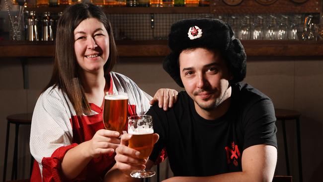 Red October co-owners Marina Tazhdynova and Roman Tazhdynov toast the World Cup. Photo: Tricia Watkinson