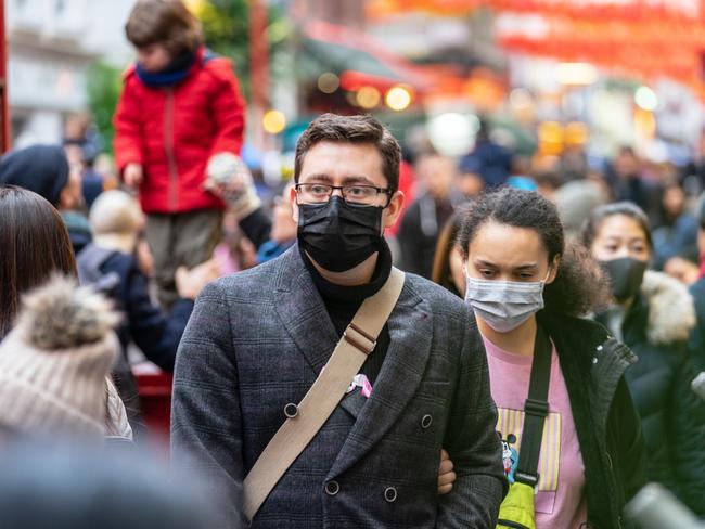 People wearing face masks in London. The outbreak has caused concern all around the world.