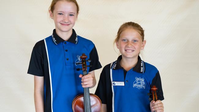 Maya McBride and Laura Wilcox from One Mile State School prepare for the small instrumental ensemble strings (primary school) at the Gympie Eisteddfod. August 1, 2023. Picture: Christine Schindler