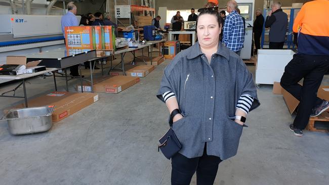 Mary-Anne Richards', wife of former Regency Custom Cabinets employee Brian, attended an auction of company goods at its Croydon Park headquarters. Picture: Renato Castello