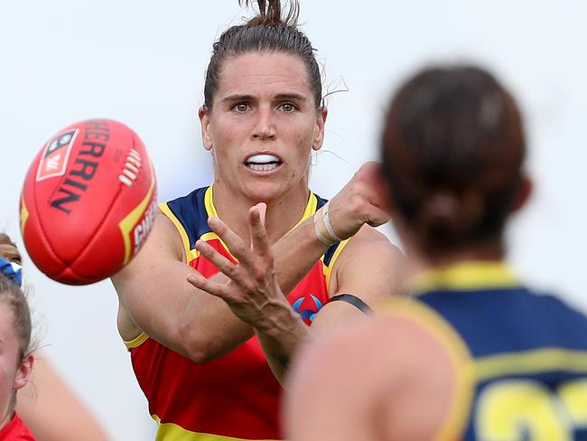 ADELAIDE, AUSTRALIA - MARCH 21: Chelsea Randall of the Crows passes the ball to Renee Forth during the 2021 AFLW Round 08 match between the Adelaide Crows and the Western Bulldogs at Norwood Oval on March 21, 2021 in Adelaide, Australia. (Photo by Sarah Reed/AFL Photos via Getty Images)