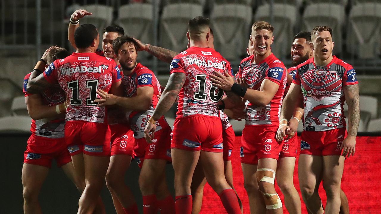 Dragons players celebrate a try scored by Matt Dufty