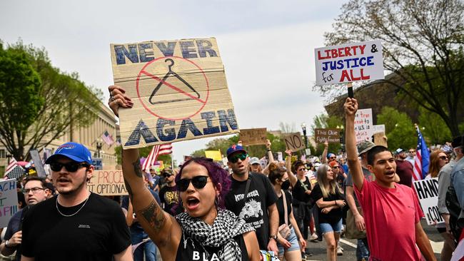 Protesters march towards the White House during a Free Kilmar Abrego and an Anti-Trump protest, in Washington. Picture; AFP.