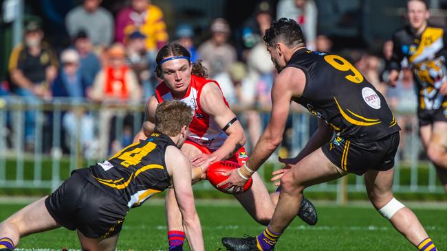 Tigers Riley Ashlin and Marcus Davies work to keep the ball away from Clarence’s Darcy Gardner. Picture: SOLSTICE DIGITAL