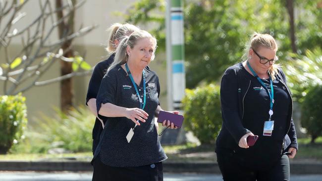 Queensland Government pathology workers arrive at Brisbane Youth Detention Centre, Wacol, which is in lockdown after a supervisor tested positive to the novel coronavirus. Photo: Liam Kidston.