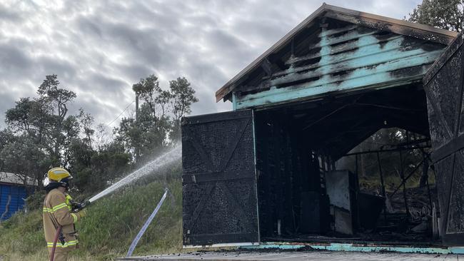 Dromana CFA returned to the blaze to ensure the smouldering remains of the boat shed were extinguished. Picture: Lucy Callander