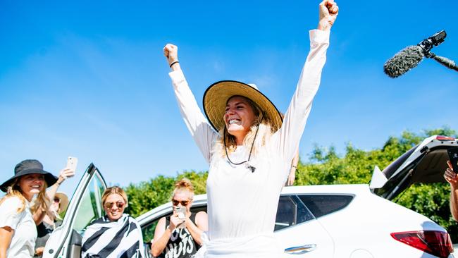 Gilmore raises her arms in celebration as the record sinks in. Picture: WSL/Sloane