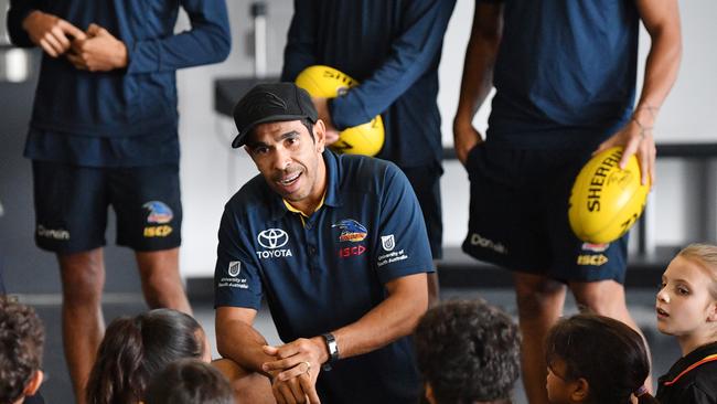 Eddie Betts speaks with indigenous school children at the Adelaide Football Club headquarters at West Lakes. Picture: David Mariuz/AAP