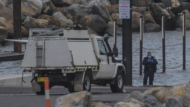 Police with one of the cars found in the water. Picture: NCA NewsWire / Roy VanDerVegt