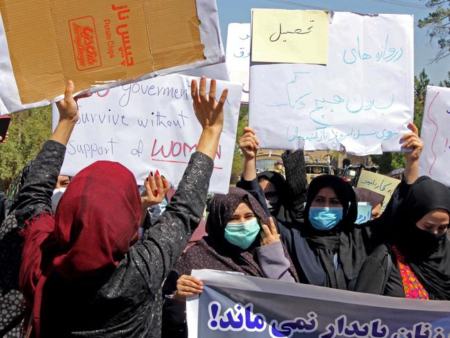 Defiant Afghan women held a rare protest saying they were willing to accept the all-encompassing burqa if their daughters could still go to school under Taliban rule. Picture: AFP