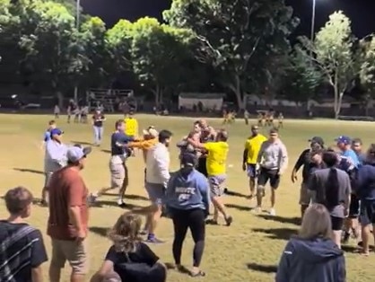 A screenshot of a video of parents fighting at an under-9s league match in Townsville on Friday.