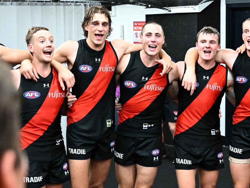 Darcy Parish, Harrison Jones, Jake Kelly, Jye Menzie and Mason Redman sing the song after Round 3. Picture: Quinn Rooney/Getty Images.