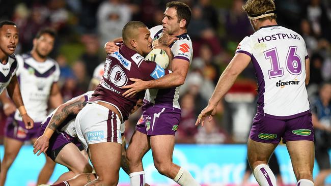 Manly’s Addin Fonua-Blake tackled by Cameron Smith of the Storm.