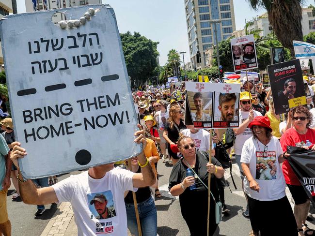 Demonstrators march during a protest by the mothers and relatives of Israelis held hostage by Palestinian militants in Gaza since the October 7 attacks, calling for efforts to save the hostages, in Tel Aviv on July 5, 2024 amid the ongoing conflict in the Gaza Strip between Israel and Hamas. (Photo by JACK GUEZ / AFP)