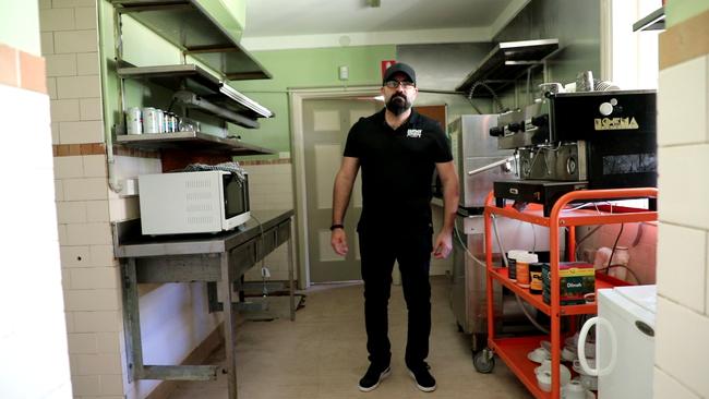 Rob Wilson standing in he kitchen at the front of Mamre Homestead.