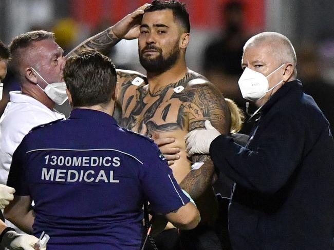 Andrew Fifita (centre) of the Sharks is seen surrounded by medical staff on the field after the game finished during the NRL Round 22 match between Cronulla Sharks and Newcastle Knights at Moreton Daily Stadium in Redcliffe, Sunday, August 15, 2021.  (AAP Image/Darren England) NO ARCHIVING, EDITORIAL USE ONLY