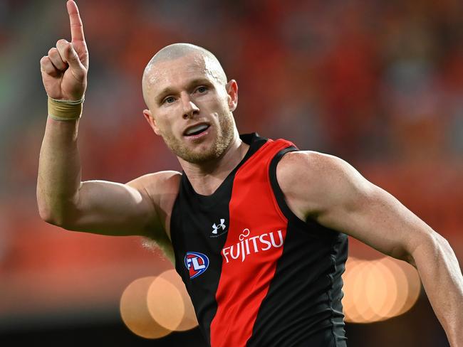 GOLD COAST, AUSTRALIA - JUNE 02: Nick Hind of the Bombers celebrates kicking a goal during the round 12 AFL match between Gold Coast Suns and Essendon Bombers at People First Stadium, on June 02, 2024, in Gold Coast, Australia. (Photo by Albert Perez/AFL Photos via Getty Images)