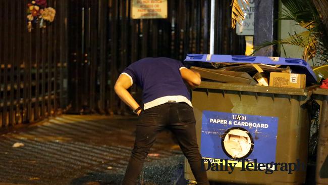 A Bulldogs player vomiting on the street during the Mad Monday celebrations. Picture: Christian Gilles