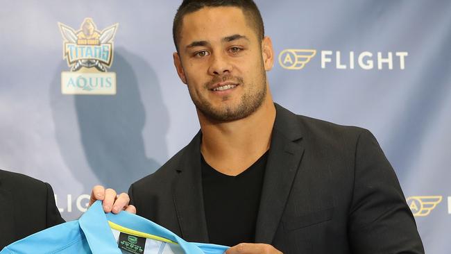 Jarryd Hayne signs with the Gold Coast Titans. With CEO Graham Annesley. Pic by Luke Marsden.