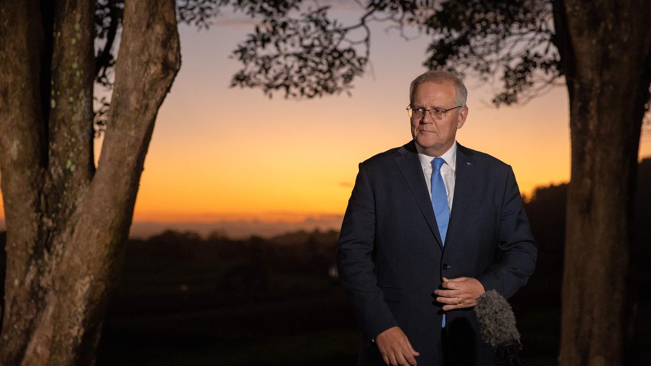 Prime Minister Scott Morrison does his first press conference to a beautiful sunset in Nowra. Picture: Jason Edwards