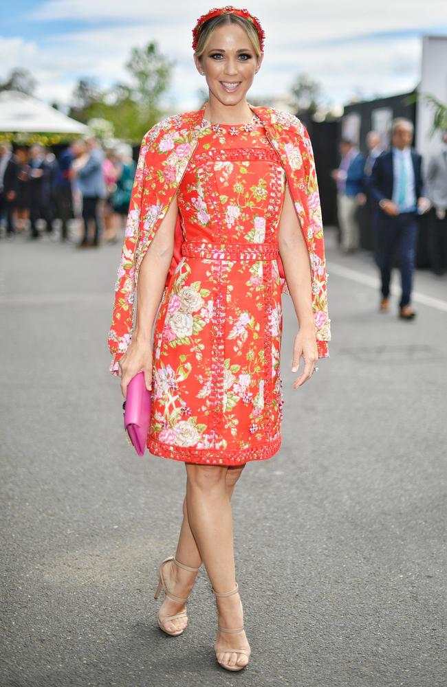 Bec Hewitt’s red floral Christah Lea dress with matching bomber jacket that she wore to the Melbourne Cup in 2016 has gone down in race day history. Picture: Jason Edwards