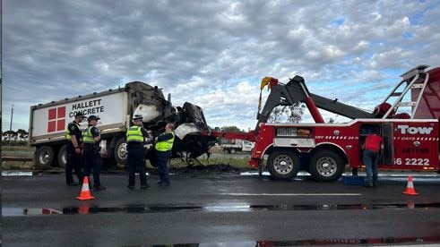 Emergency services at the scene after a woman died in a collision with a concrete truck. Picture: Natalie Vikhrov