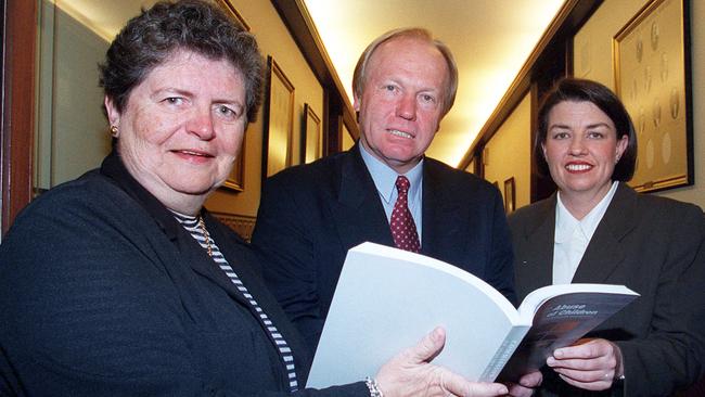 Leneen Forde with then premier Peter Beattie and families minister Anna Bligh handing over her report.