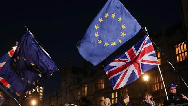 Anti-Brexit campaigners outside the Houses of Parliamentas Tory MPs vote on Theresa May’s leadership. Picture: AFP.