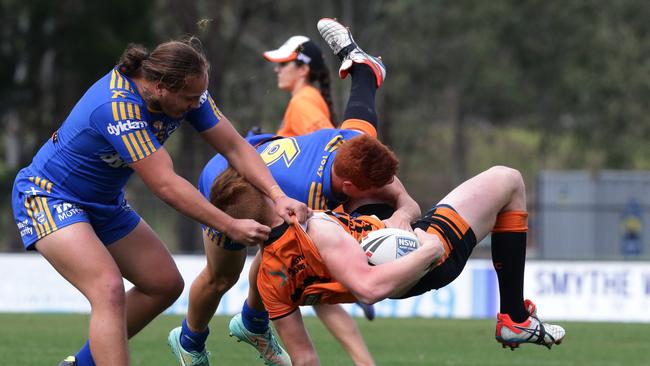 Balmain’s Alex Seyfarth coping some attention from Parramatta rivals in his Harold Matthews Cup days.