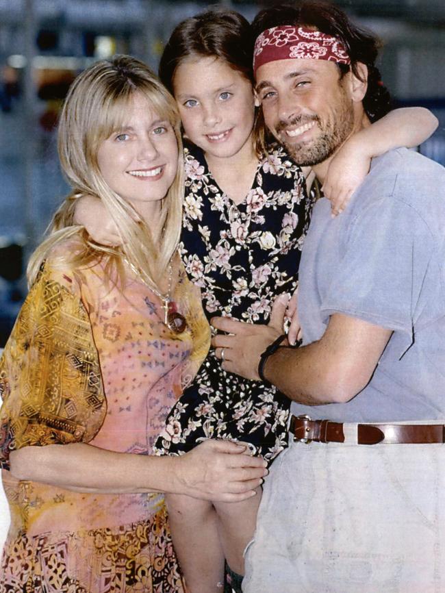 Olivia Newton-John, with daughter Chloe and then husband Matt Lattanzi, arrive at Sydney Airport in 1993.