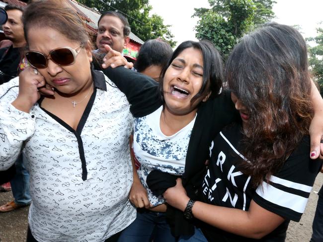 Watching their pain was at times almost too much ... Brintha Sukumaran breaks down as she arrives to visit her brother Myuran Sukumaran for the last time before being executed. Picture: Adam Taylor