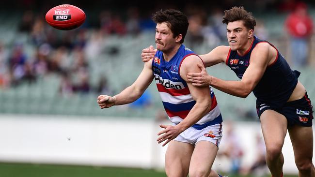 Modbury’s Ryan Llewellyn battles Payneham Norwood Union’s Harrison Viney for Central District in the SANFL. Picture: Tom Huntley