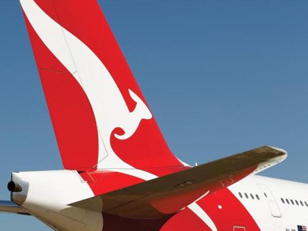 06/09/2012 BUSINESS: The Qantas Airways Ltd. logo is displayed on the tail of an aircraft during a media event in Sydney, Australia, on Thursday, Sept. 6, 2012. Qantas formed an alliance with Emirates Airline to coordinate prices and schedules, while scrapping a similar deal with British Airways, as the carrier tries to reverse losses on long-haul routes. Photographer: Brendon Thorne/Bloomberg