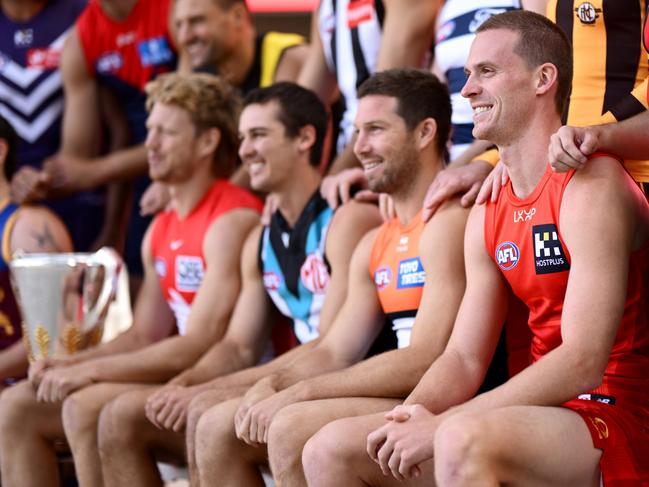 MELBOURNE, AUSTRALIA - FEBRUARY 24: AFL Captains   Callum Mills of the Swans, Connor Rozee of the Power, Toby Greene of the Giants and Noah Anderson of the Suns pose for a photo with the premiership cup during 2025 AFL Captain's Day at Marvel Stadium on February 24, 2025 in Melbourne, Australia. (Photo by Quinn Rooney/Getty Images)